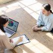 Couple of woman consulting in modern room. High angle view.