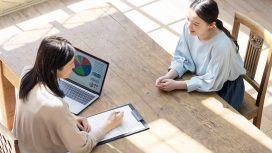 Couple of woman consulting in modern room. High angle view.