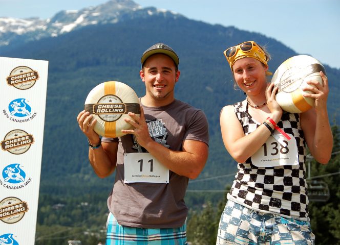 
Joslyn Kent from Sydney, Australia and Tyler Belan from Kitchener, Ontario are the 2012 Canadian Cheese Rolling Festival champions (CNW Group/Dairy Farmers of Canada (DFC))