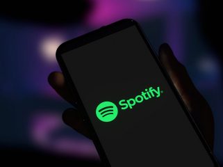 Spotify logo displayed on smartphone screen. Editorial 3d rendering.